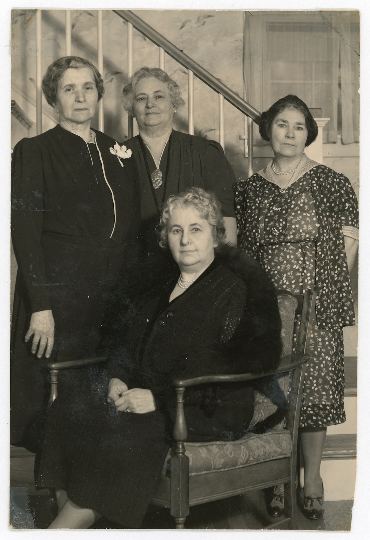 four women posed